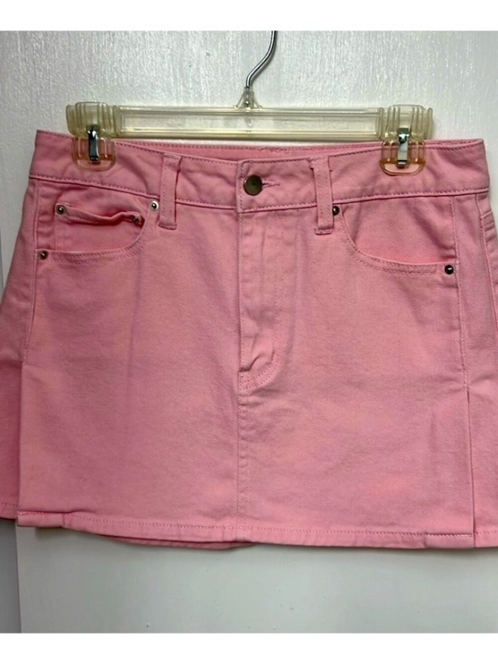 pink denim miniskirt with front slits on each leg, Size 7